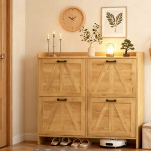 Light oak farmhouse shoe cabinet with four flip drawers and black handles in an entryway