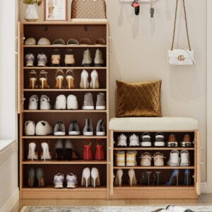 Oak shoe storage cabinet with cushioned bench and multiple shelves in an entryway