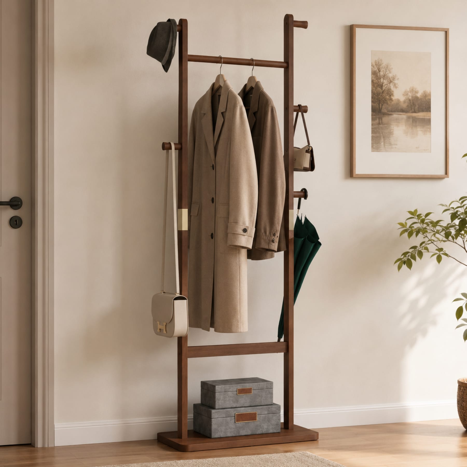 Walnut solid wood freestanding coat rack with hanging rod, side hooks, coats, hat, bag, scarf, and umbrella in an entryway