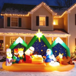 9 ft wide lighted Christmas inflatable nativity scene with starry night backdrop, Holy Family, Three Wise Men, and animals in a snowy front yard