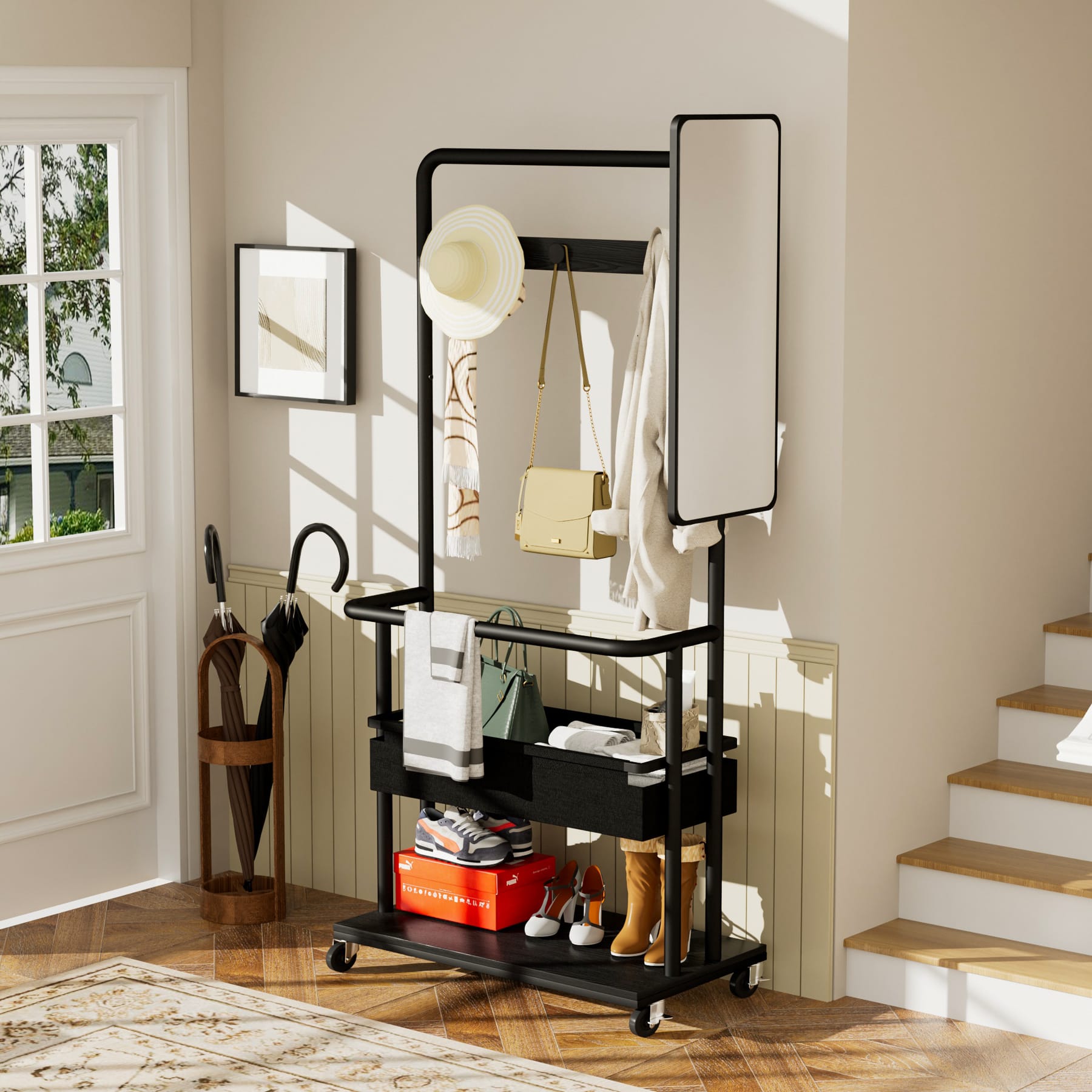 Black rolling coat rack with side mirror, hanging hooks, fabric storage basket, and lower shoe shelf beside an entryway staircase