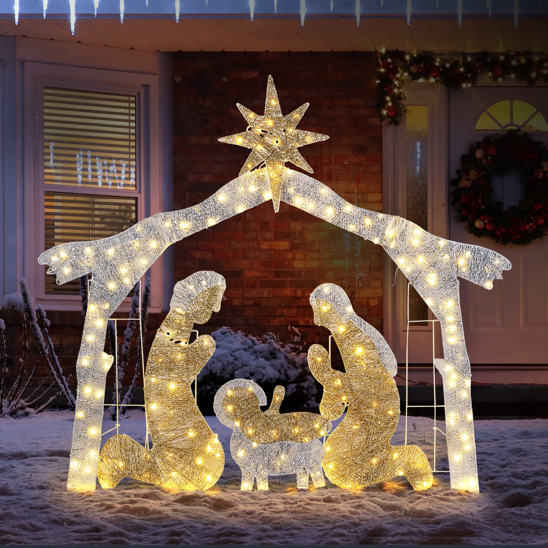 190 LED silver roof Christmas Nativity scene with illuminated Bethlehem star and figures displayed on a snowy front porch at night