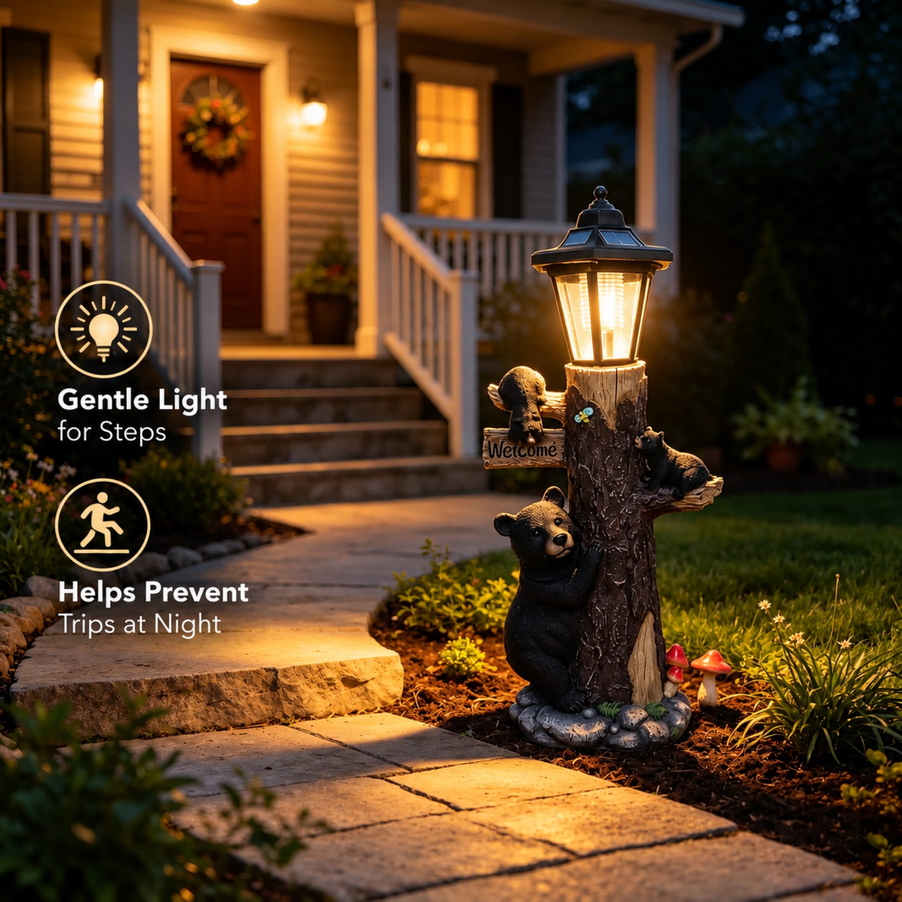 Solar bear garden light beside a stone walkway and front steps with soft nighttime illumination